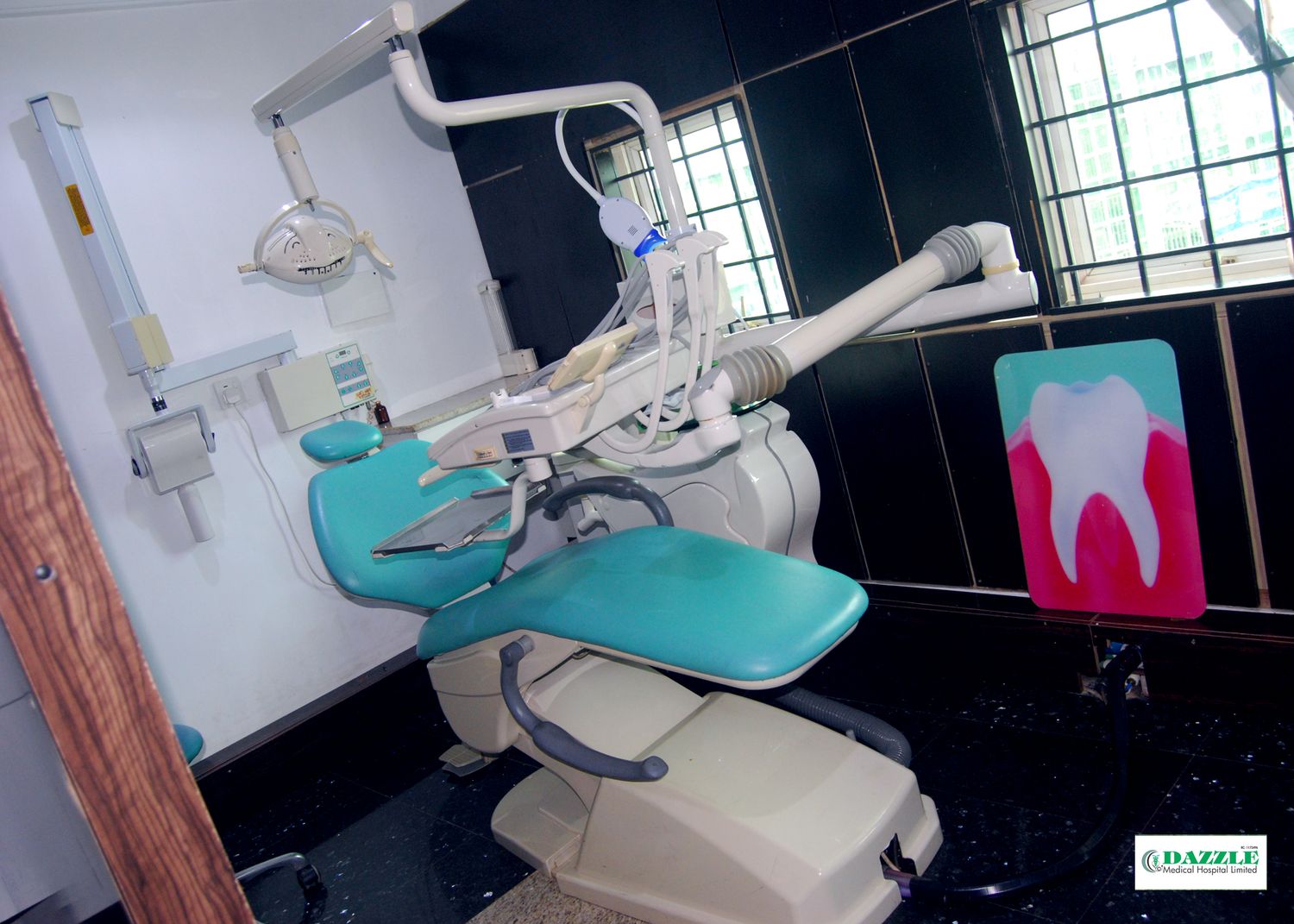 Dentist at Dazzle Dental performing a careful clinical examination