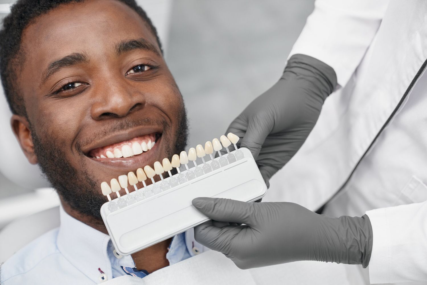 Dentist discussing porcelain veneer options with a patient